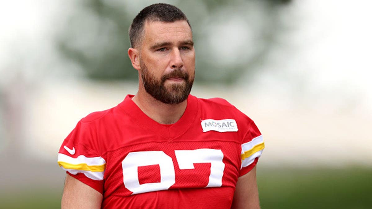 Travis Kelce walks toward the practice field during Kansas City Chiefs training camp.