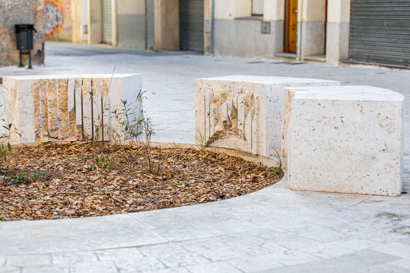 carved travertine transforms paving, furniture, and planting across spanish historic old town - 3