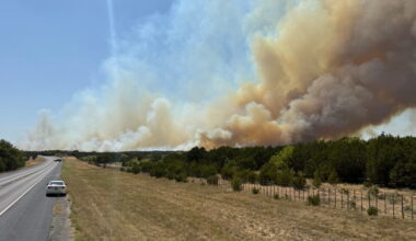 Texas wildfire forces evacuations even as Reno fire slows