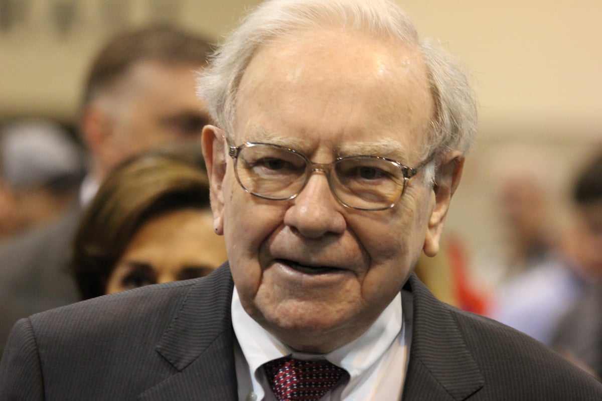 Warren Buffett in front of a small crowd.