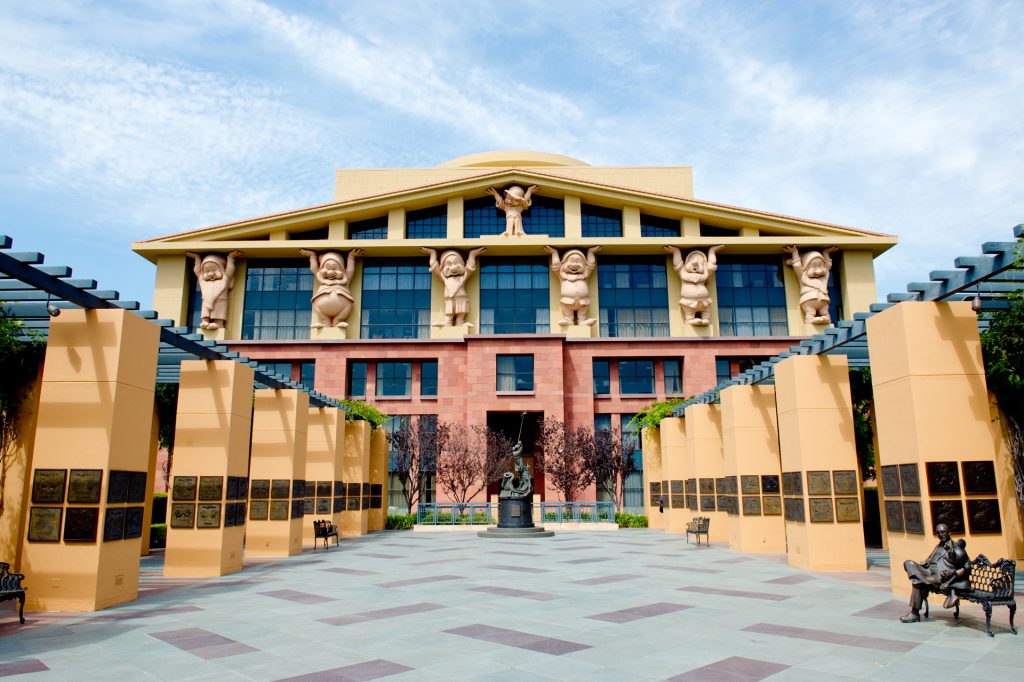 Walt Disney Company building with the Seven Dwarves holding up the roof.