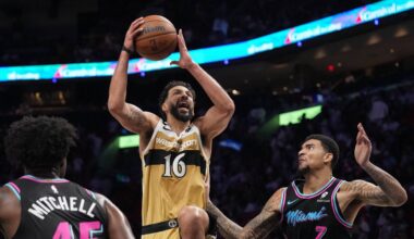 Apr 4, 2026; Miami, Florida, USA;  Washington Wizards forward Anthony Gill (16) drives to the basket as Miami Heat center Kel'el Ware (7) defends during the second half at Kaseya Center. Mandatory Credit: Jim Rassol-Imagn Images