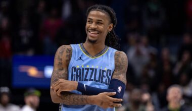 Dec 26, 2023; New Orleans, Louisiana, USA; Memphis Grizzlies guard Ja Morant (12) smiles at a fan as the end of regulation against the New Orleans Pelicans at Smoothie King Center. Mandatory Credit: Stephen Lew-USA TODAY Sports