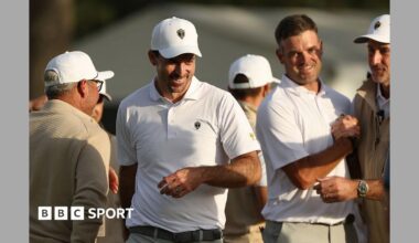 Canada's Corey Conners (centre) saved par on the 18th