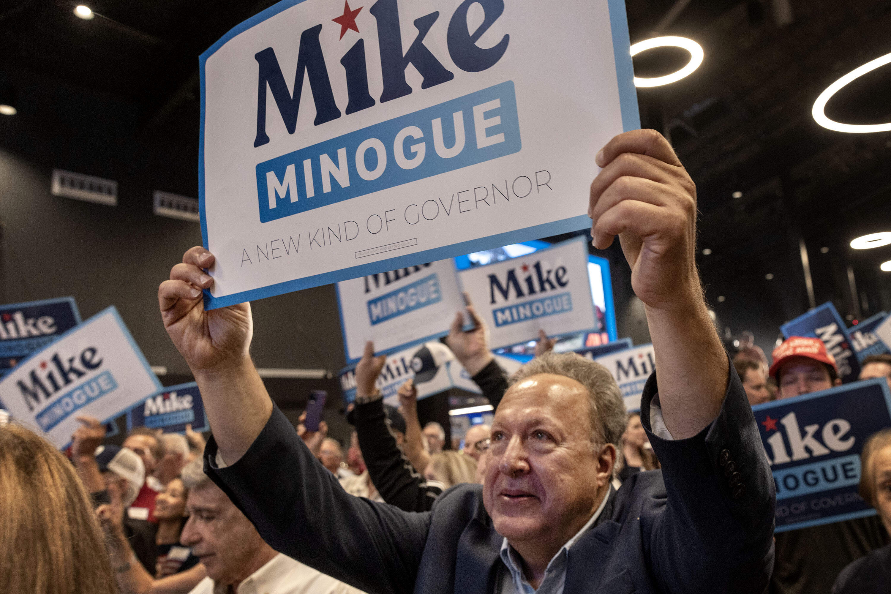 Supporters of Mike Minogue celebrate his primary win Tuesday. (Robin Lubbock/WBUR)