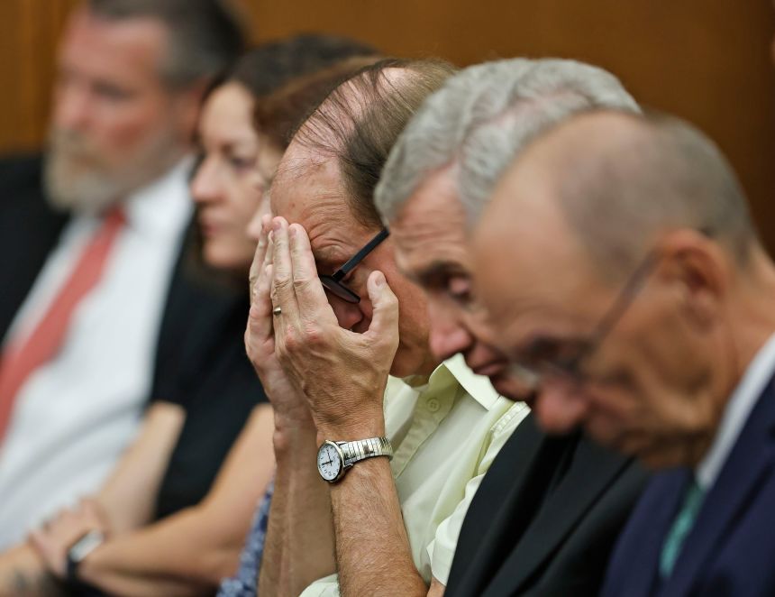 Lindsay Clancy's father placed his hands over his face in reaction to a question from her jury.