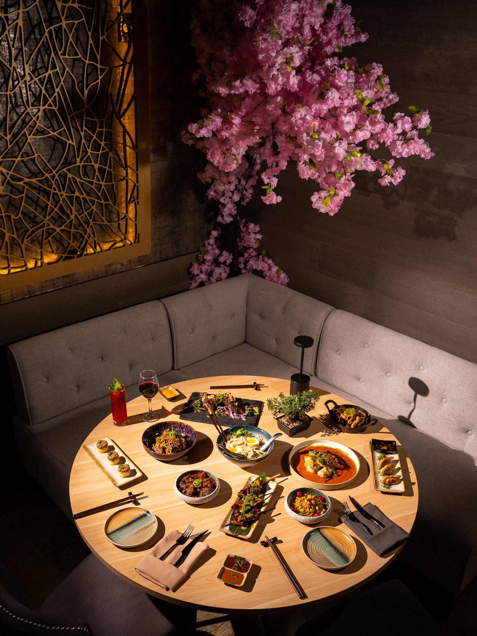 Dining room table with dishes at Koji & Coal in Fort Lauderdale