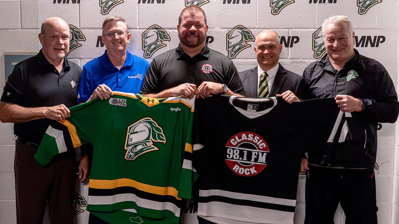 From left to right, Mark Hunter, London Knights co-owner and general manager, Ron Dann, president of Blackburn Radio Inc., Jon Eisler,  director of sales at Blackburn Radio Inc., Mike Stubbs, voice of the London Knights, and Dale Hunter, co-owner, pr
