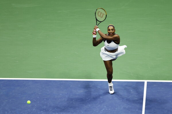 Serena Williams, of the United States, hits a return as she plays a women's doubles match with partner Venus Williams against Hao-Ching Chan, of Taiwan, and Maya Joint, at the U.S. Open tennis championships, Friday, Sept. 4, 2026, in New York. (AP Photo/Adam Hunger)