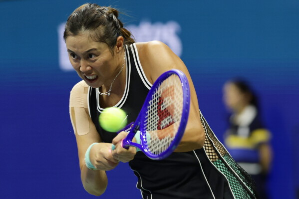 Hao-Ching Chan, of Taiwan, hits a return as she plays a women's doubles match with partner Maya Joint, of Australia, against Venus Williams and Serena Williams, of the United States at the U.S. Open tennis championships, Friday, Sept. 4, 2026, in New York. (AP Photo/Adam Hunger)