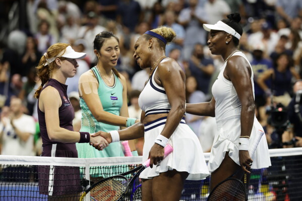 Venus, right, and Serena Williams, of the United States, congratulate Maya Joint, left, of Australia, and Hao-Ching Chan, of Taiwan, after their women's doubles match at the U.S. Open tennis championships, Friday, Sept. 4, 2026, in New York. (AP Photo/Adam Hunger)