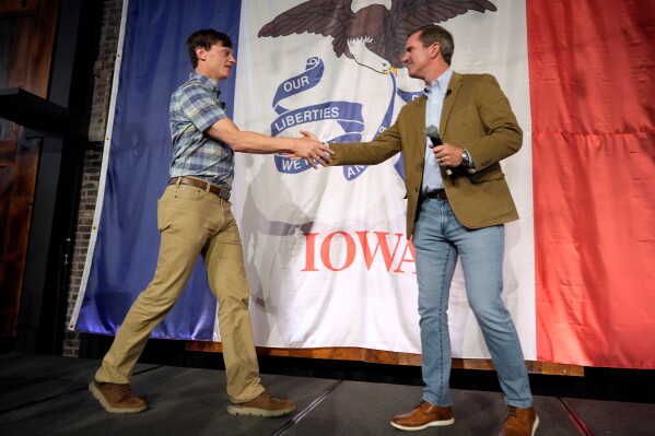 Iowa Democratic gubernatorial candidate Rob Sand, left, greets Kentucky Gov. Andy Beshear during a campaign rally, June 7, 2026, in Des Moines, Iowa. (AP Photo/Charlie Neibergall, File)