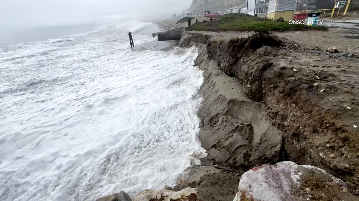 On Sunday, waves eroded the bluff at Point Dume State Beach where the previous high turf eroded the bluff last month. 