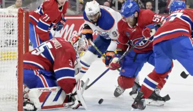 Loose puck in front of Montreal Canadiens goalie Sam Montembeault (35) and teammate defenseman David Savard (58) and Edmonton Oilers forward Evander Kane (91) during the third period at the Bell Centre.
