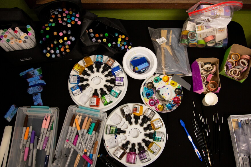 Art supplies are displayed at the Film Strip Club meeting at the Howson Branch Library.