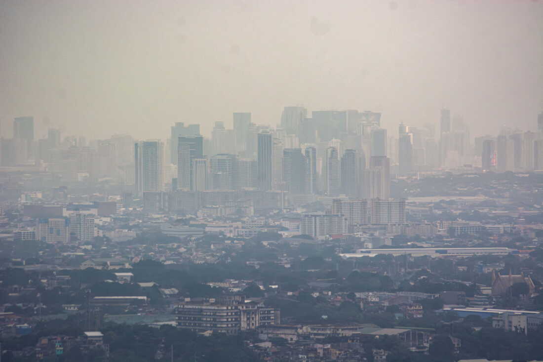 Smog mixed with a thick layer of clouds covers the Metro Manila skyline in the Philippines, on August 27, 2026.