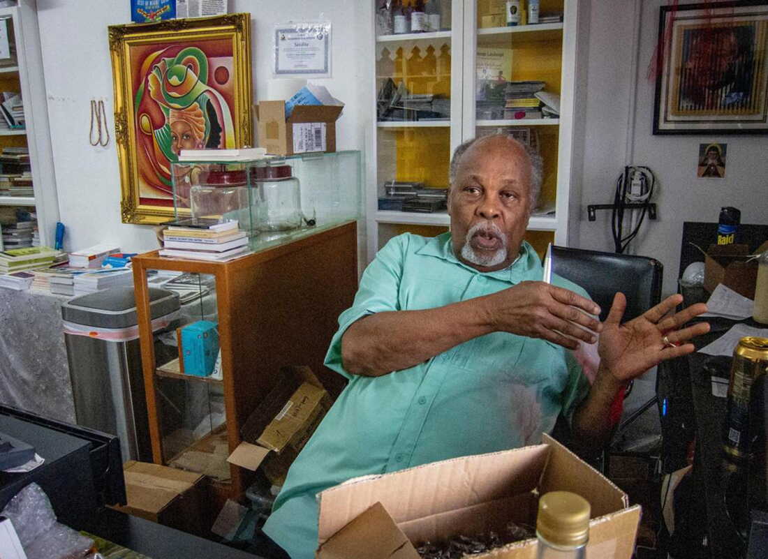 Jan Mapou, owner of Libreri Mapou, talks about the situation in Haiti inside his shop in Miami's Little Haiti neighborhood in 2024.