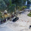 People wait outside the Miami Immigration Court on Wednesday, Sept. 2, 2026 in Miami, Fla. Eva Marie Uzcategui for NPR