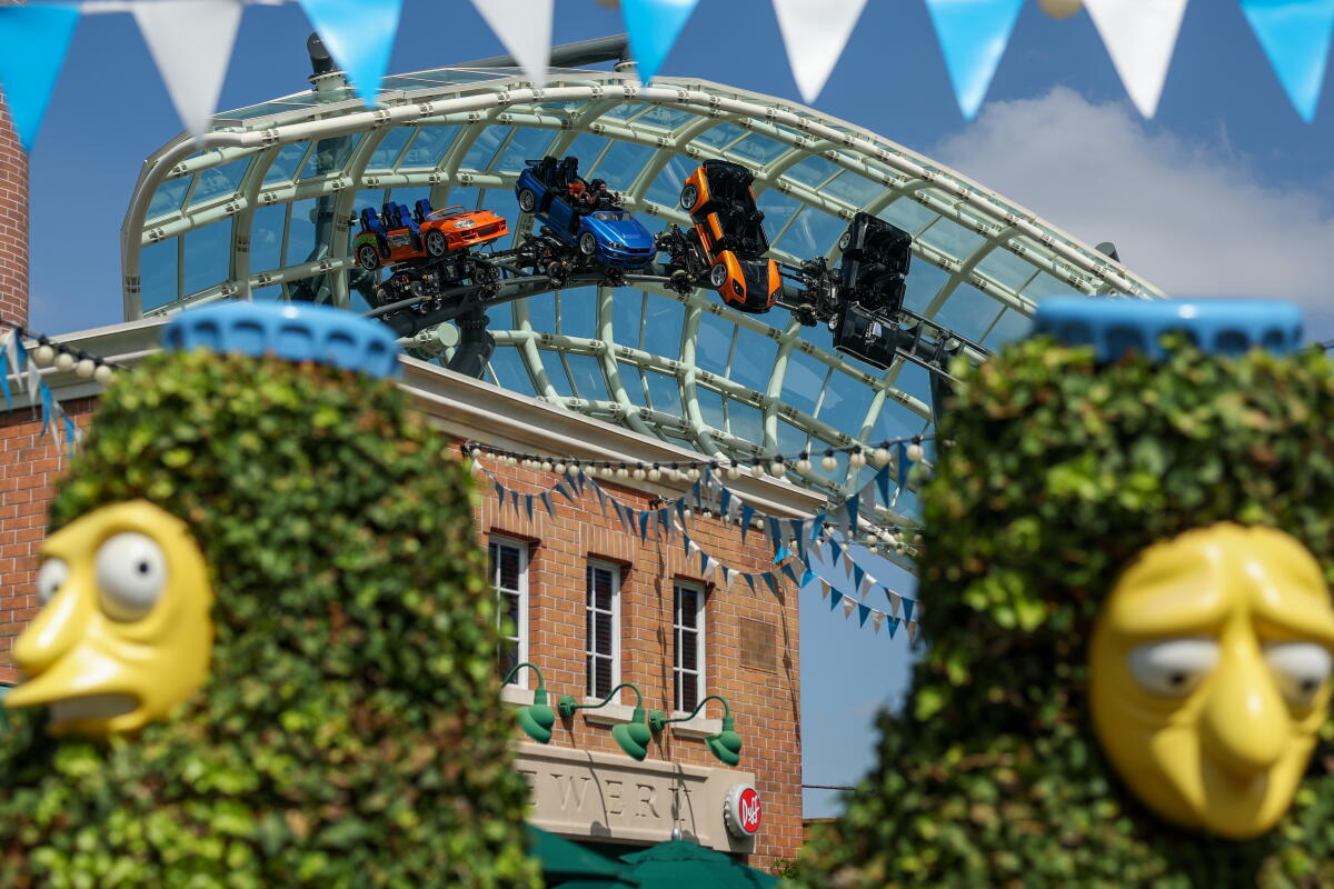 Universal Studios Hollywood's Fast & Furious: Hollywood Drift towers over the theme park.