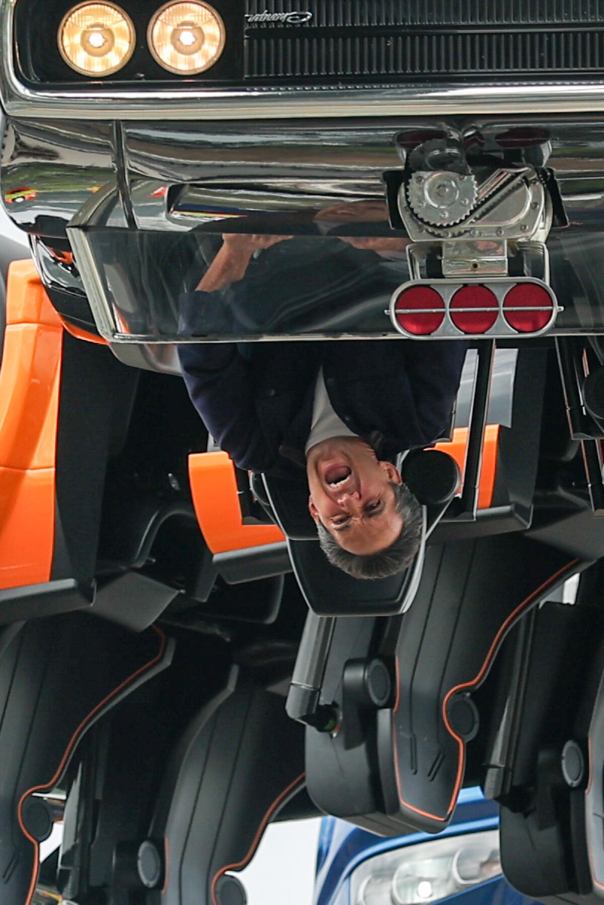 An upside down rider enjoying Fast & Furious: Hollywood Drift at Universal Studios Hollywood.