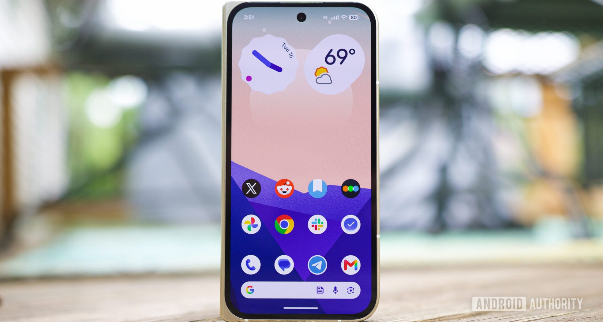A Pixel running Android 17, showing the home screen with hidden app icon names.