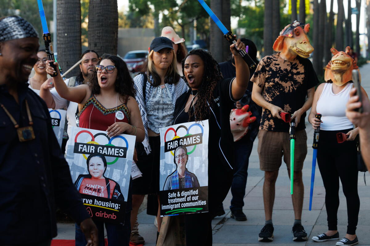 Demonstrators at a Fair Games Coalition protest at the Lucas Museum of Narrative Art.
