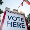 Signage directs voters at a polling place in White Bear Township, Minn., on Aug. 11.