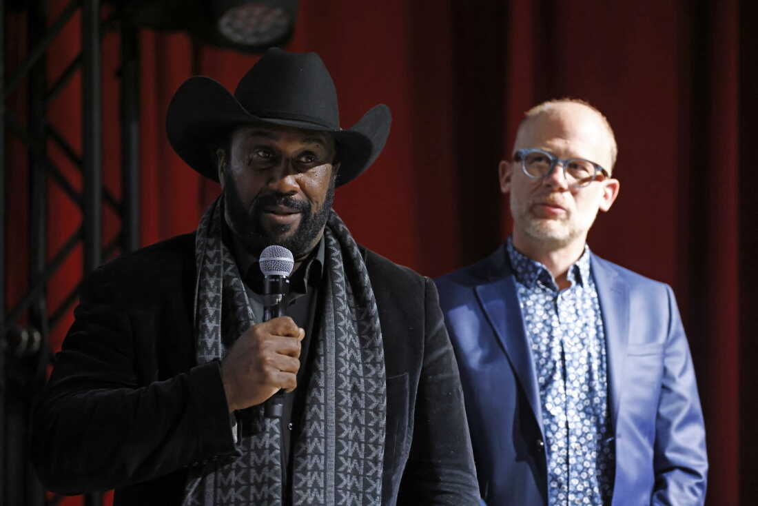 John Boyd Jr., left, and filmmaker Josh Tickell speak at the Washington premiere of “Common Ground” on Nov. 13, 2023. Boyd is a fourth-generation Virginia farmer and president of the National Black Farmers Association.
