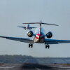 The FAA says it wants to build a brand new air traffic control system that can use software to prevent conflicts, delays and cancellations. Here, passenger jets land and take off at Reagan National Airport in Washington, D.C., in March. Last year, the airport saw a tragic midair collision between a regional airliner and a military helicopter.