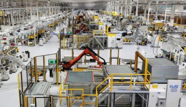 Industrial robots are operating on an intelligent production line in a smart manufacturing enterprise in Yangzhou, East China