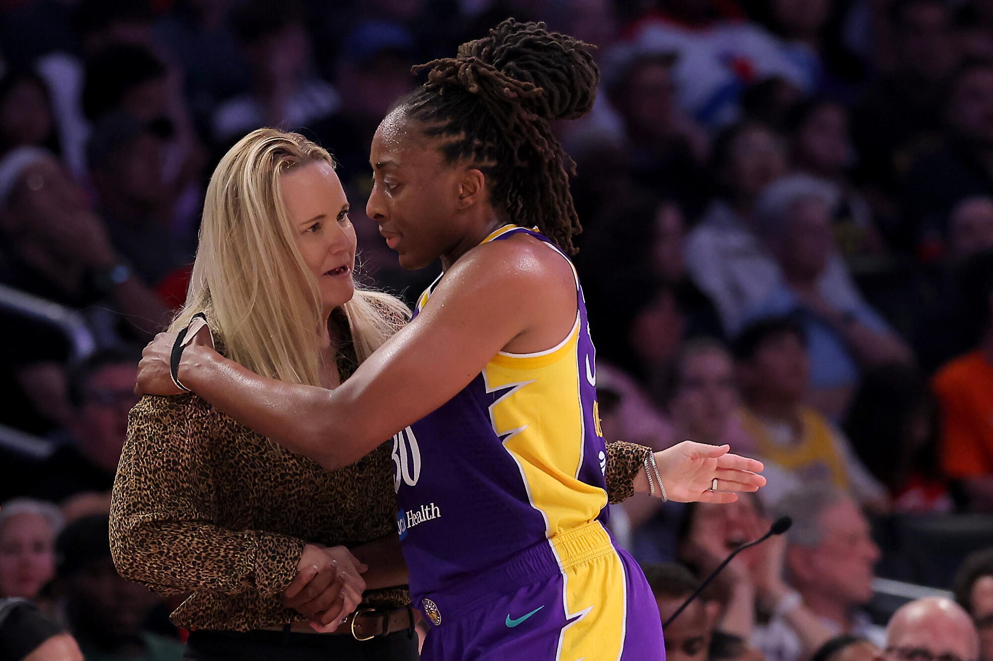 Sparks coach Lynne Roberts and Nneka Ogwumike talk on the sideline during a win over the Indiana Fever.