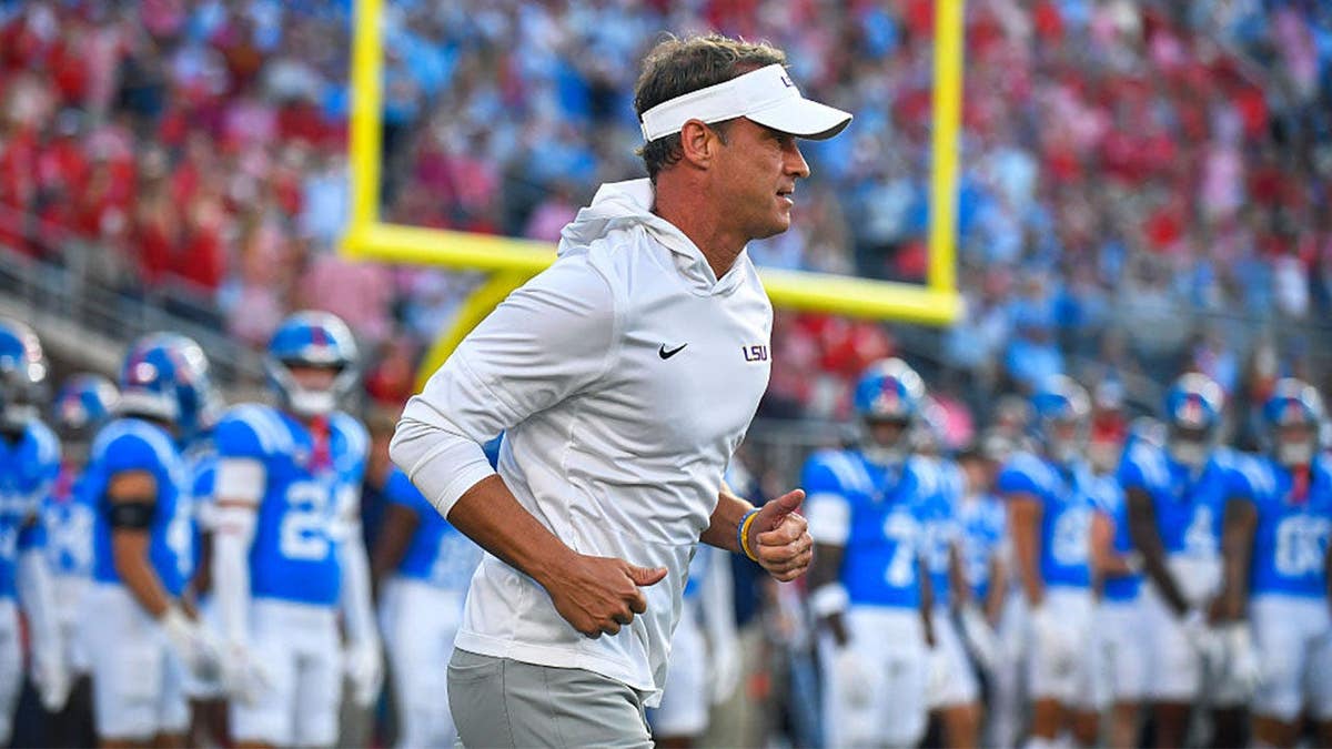 LSU Tigers coach Lane Kiffin runs onto the field during pregame of a college football game between the LSU Tigers and Mississippi Rebels on Saturday, September 19, 2026 at Vaught-Hemingway Stadium in Oxford, MS.