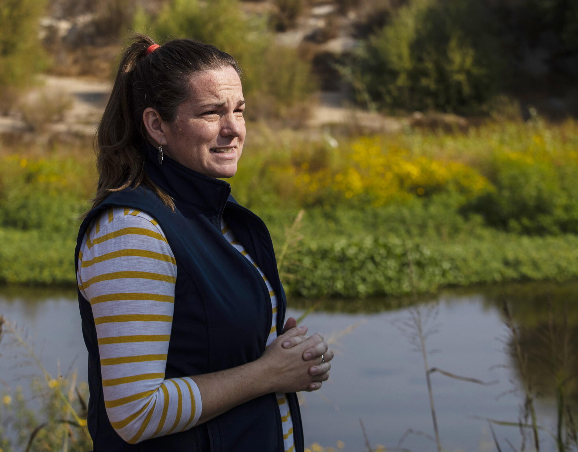 Julie Rentner, president of River Partners, stands by the Tuolumne River in a restored floodplain at Dos Rios State Park.