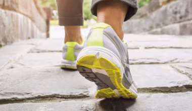 close up of woman's sneakers while walking