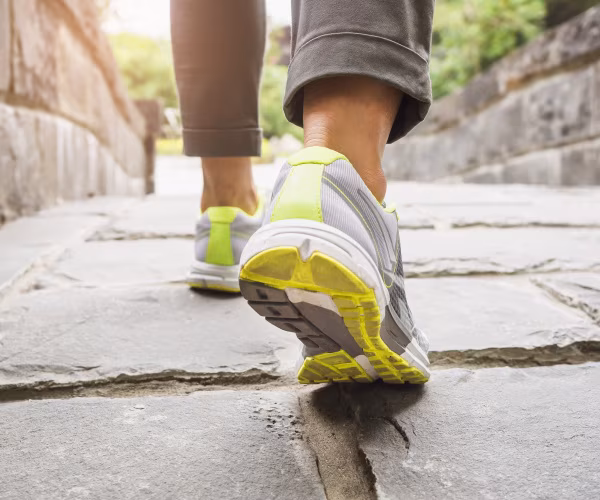 close up of woman's sneakers while walking