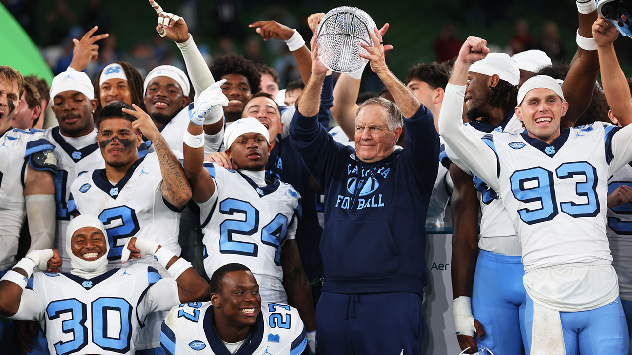 Head coach Bill Belichick and his Tar Heels team celebrate after defeating TCU on Saturday in Dublin, Ireland.