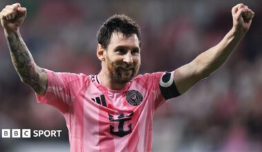 Lionel Messi holding his arms aloft in celebration while playing for Inter Miami