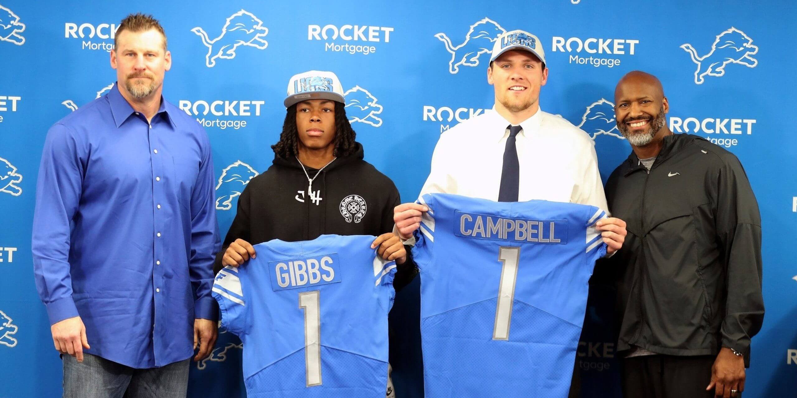 Detroit Lions coach Dan Campbell, Jahmyr Gibbs from Alabama, Jack Campbell from Iowa, and general manager Brad Holmes pose during the players' introductory news conference at team headquarters in Allen Park on Friday, April 28, 2023.