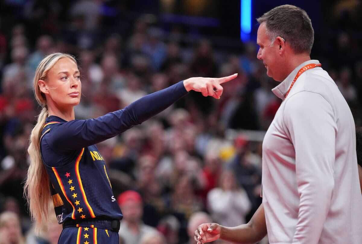 Indiana Fever guard Sophie Cunningham (8) points to Phoenix Mercury forward-guard DeWanna Bonner (24) after an argument broke out Monday, June 22, 2026, during the game at Gainbridge Fieldhouse in Indianapolis. The Indiana Fever defeated the Phoenix Mercury, 86-77.