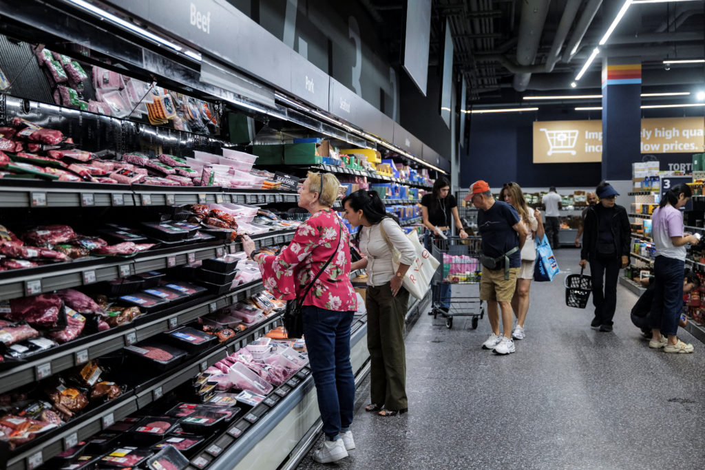 People shop for groceries in New York City