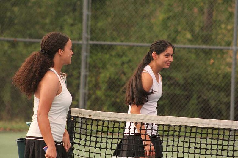 Hot Springs Trojans No. 2 girls doubles tennis team of Savannah Randall and Hilda Yanes take their positions during Tuesday's tri-meet with Lakeside and White Hall at Lakeside. (The Sentinel-Record/Pat Geans)