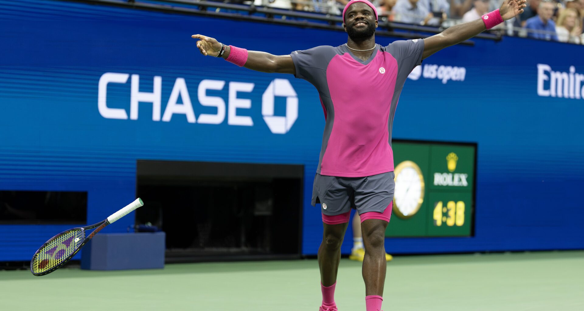 Frances Tiafoe celebrates with his arms spread to his side after his US Open match.