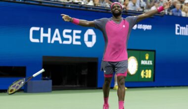 Frances Tiafoe celebrates with his arms spread to his side after his US Open match.