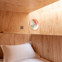 © Xhot Red Submarine Cabin / Wiki World - Interior Photography, Bedroom, Wood