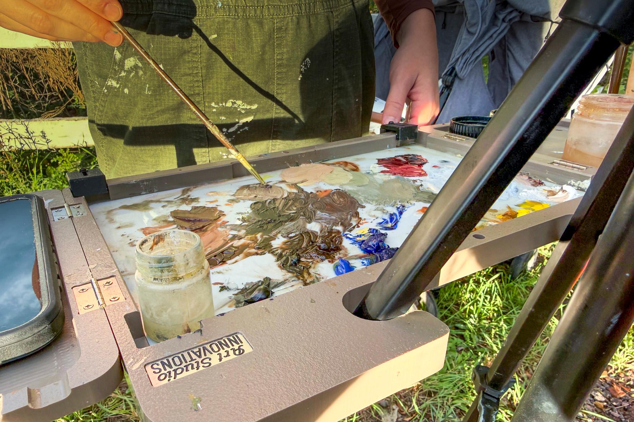 Katie Sermons works on a plein air painting in Colorado Springs. Aug. 28, 2026.