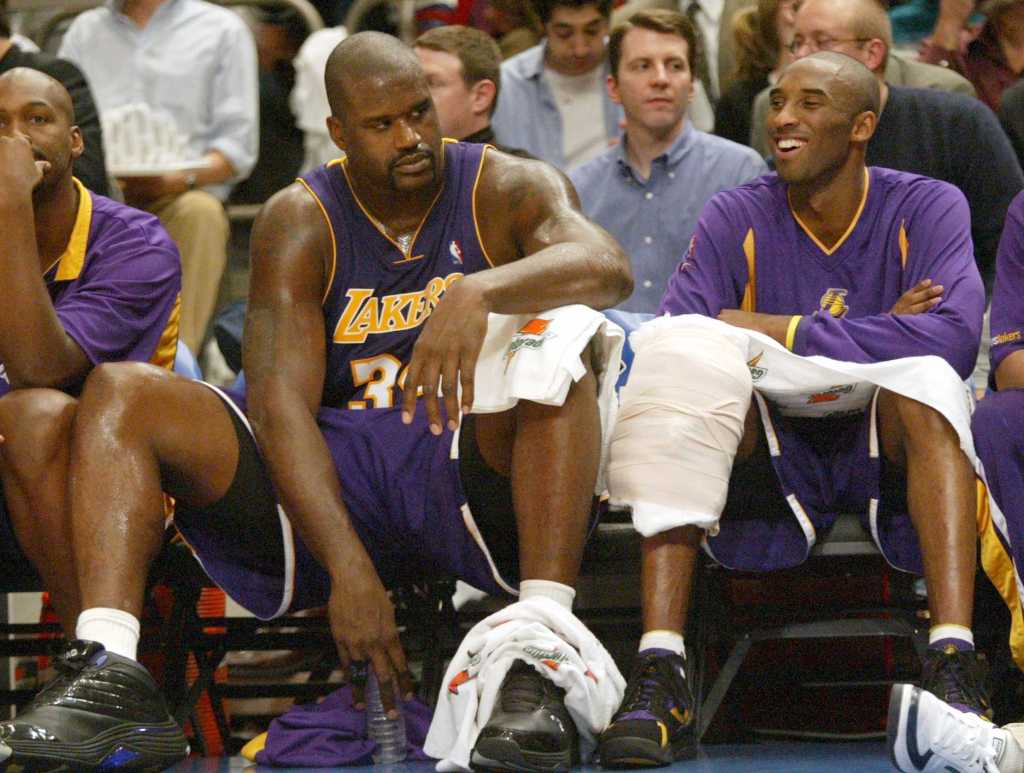 Shaquille O'Neal and Kobe Bryant of the Los Angeles Lakers sitting on the bench.