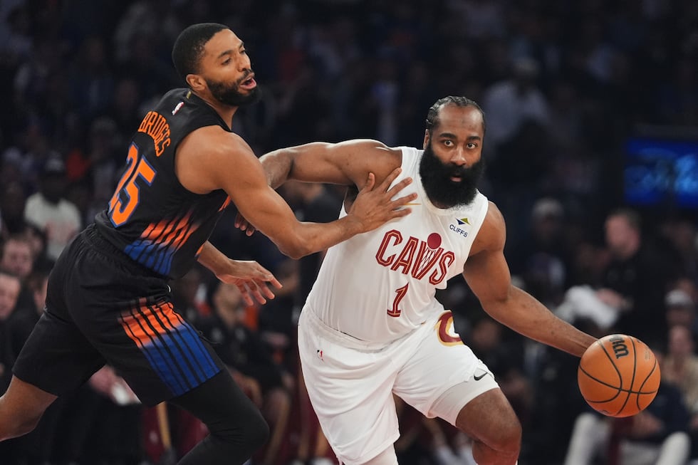 Cleveland Cavaliers' James Harden (1) drives past New York Knicks' Mikal Bridges (25) during...