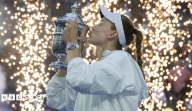 Elena Rybakina lifts the US Open trophy with Aryna Sabalenka looking on