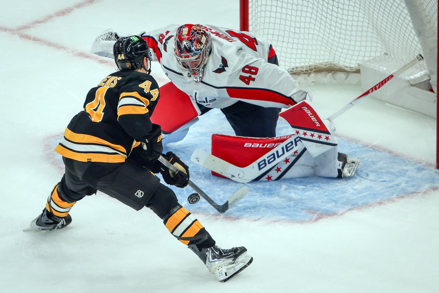 Bruins center James Hagens goes to his backhand to slip the puck past Capitals goaltender Logan Thompson for the only goal in the shootout.