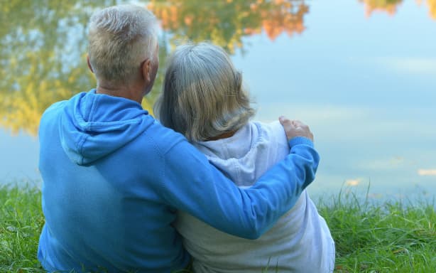 Mature couple walking in the park in the afternoon